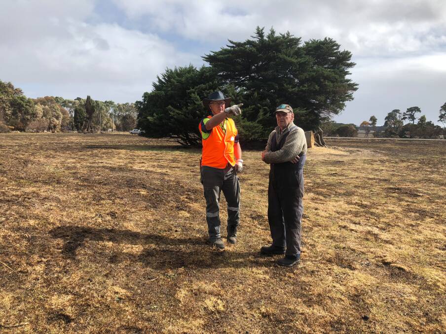 Helping: Blaze Aid volunteer Tim Walsh talks to Elingamite farmer Keith Smith about the work that he needs to have done. Picture: Rob Gunstone