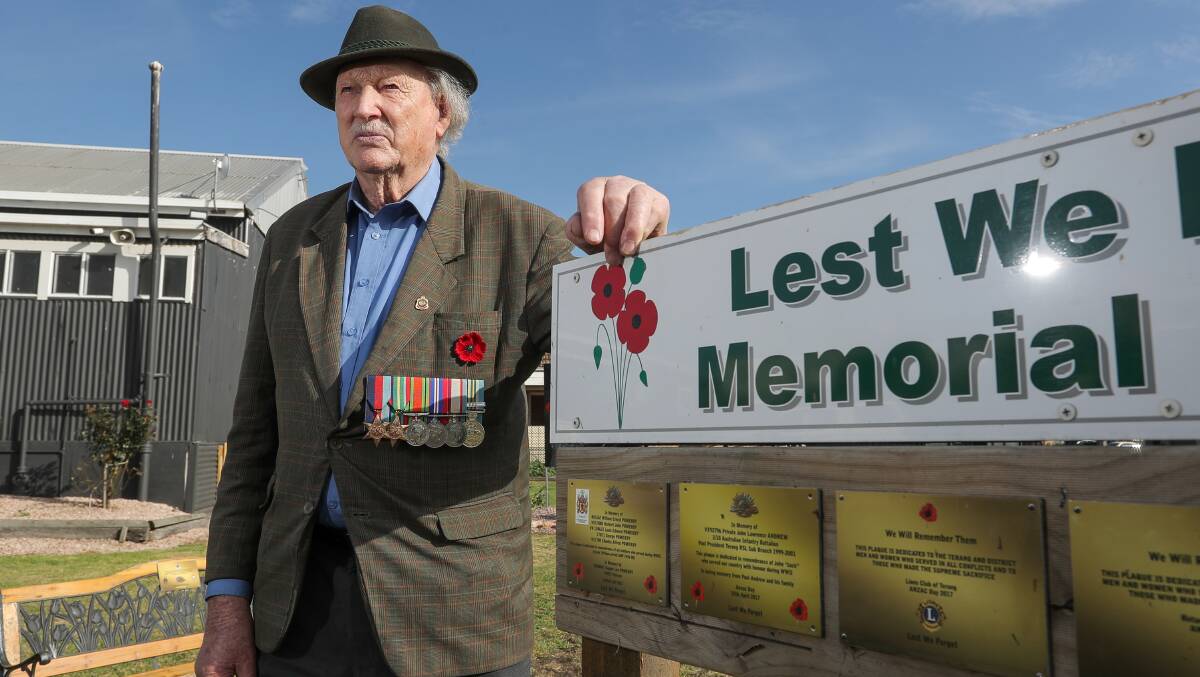 A time to remember: Terang RSL's oldest member Len Pomeroy, who worked as a sapper engineer during WWII, with the plaque at Terang RSL honouring the Pomeroy brothers who served.  Picture: Rob Gunstone