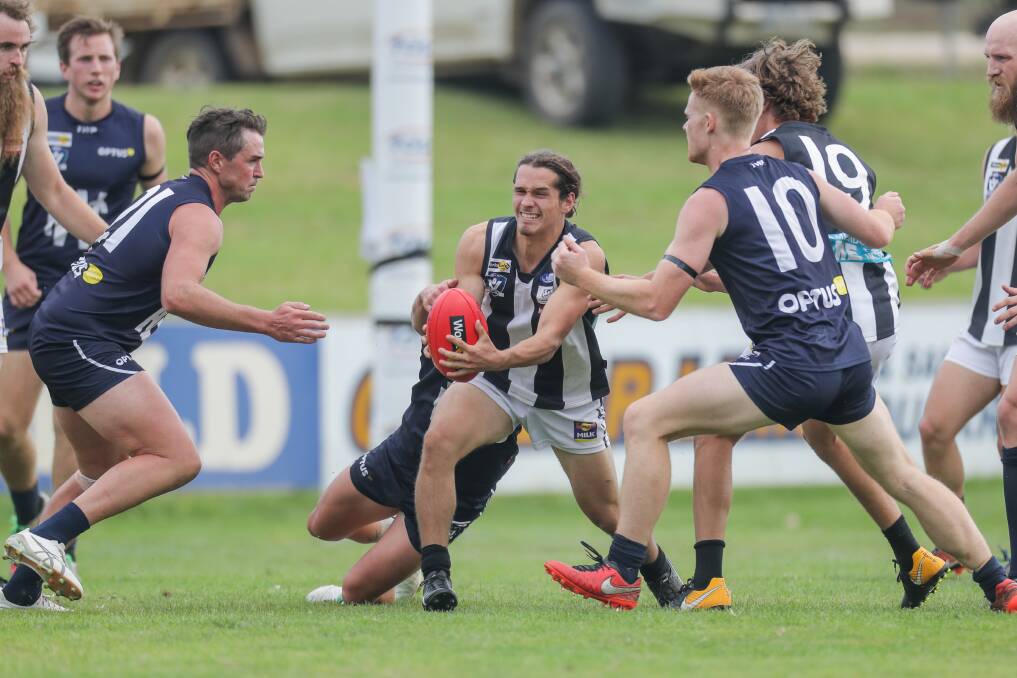 ROUND TWO: Camperdown's Josh Bone weaves his way through traffic as the Magpies secured a rare win at Reid Oval. Picture: Morgan Hancock