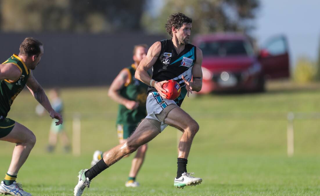 SPEED: Jason Moloney shows a clean pair of heals as he looks to move the Power forward. Picture: Morgan Hancock