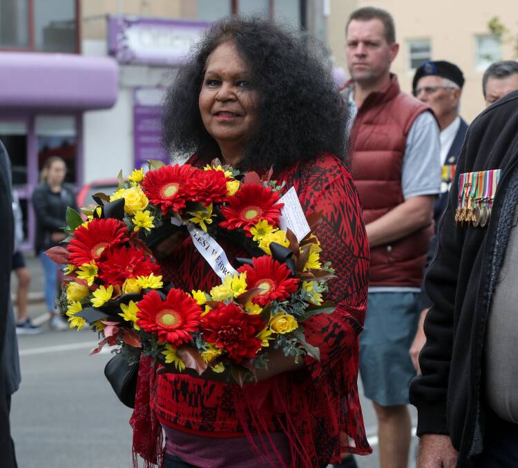 Paying tribute: Fiona Clarke carries a wreath at ANZAC Day 2018. Picture: Rob Gunstone