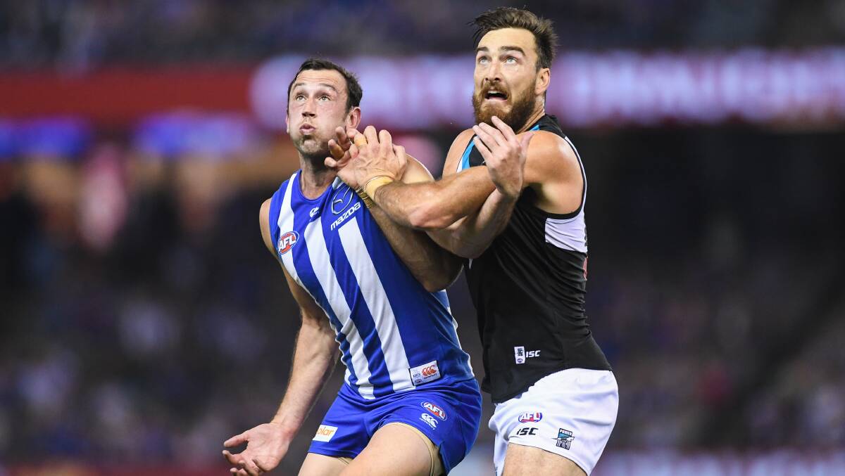 GOOD BATTLE: Todd Goldstein of North Melbourne and Charlie Dixon of Port Adelaide battle in the ruck. Picture: Morgan Hancock .