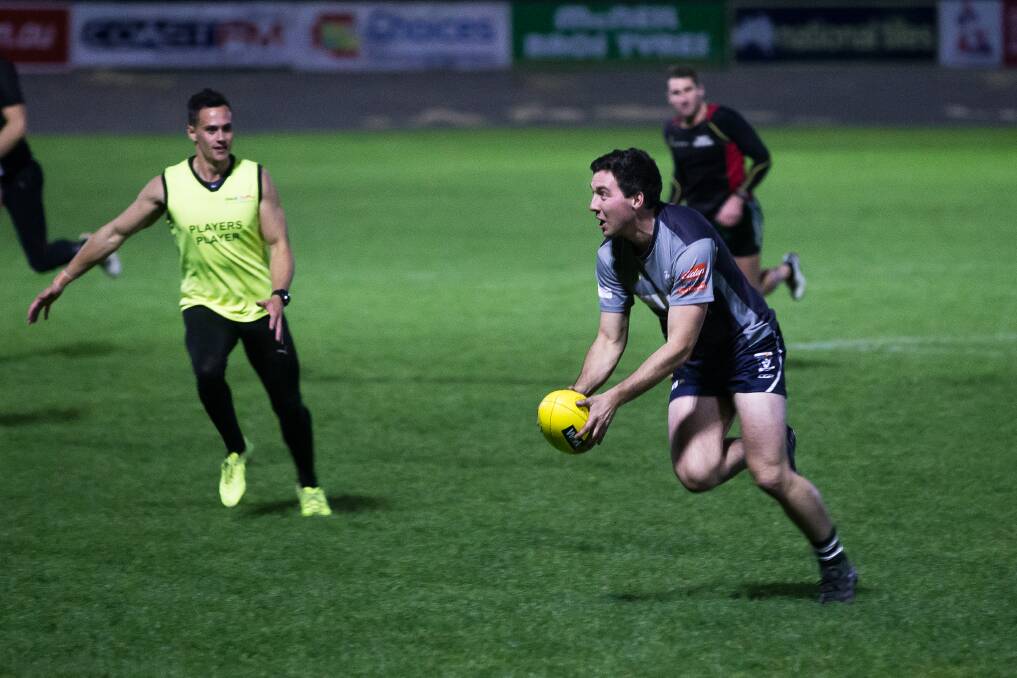 On the move: Warrnambool star Jackson Bell evades his Blues team mate Luke Cody during Hampden interleague training on Tuesday night at the Friendly Societies' Park. Picture: Christine Ansorge