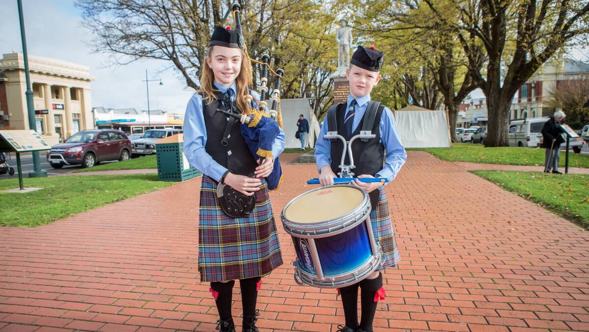 Performers: Warrnambool and District Pipe and Drums Band members Zahli and Harry Clark prepare to play at the festival.