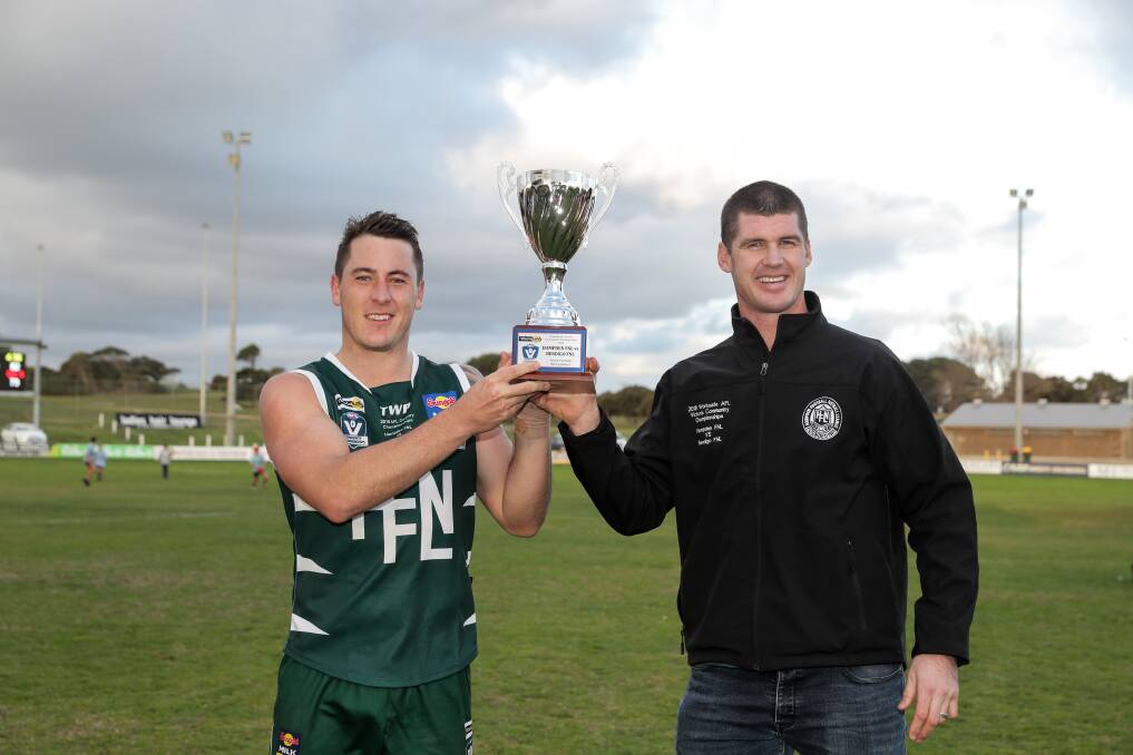 TOO GOOD: Hampden captain Sam Cowling and coach Jonathan Brown with the spoils of the Bottle Greens' 2018 interleague success. Picture: Rob Gunstone