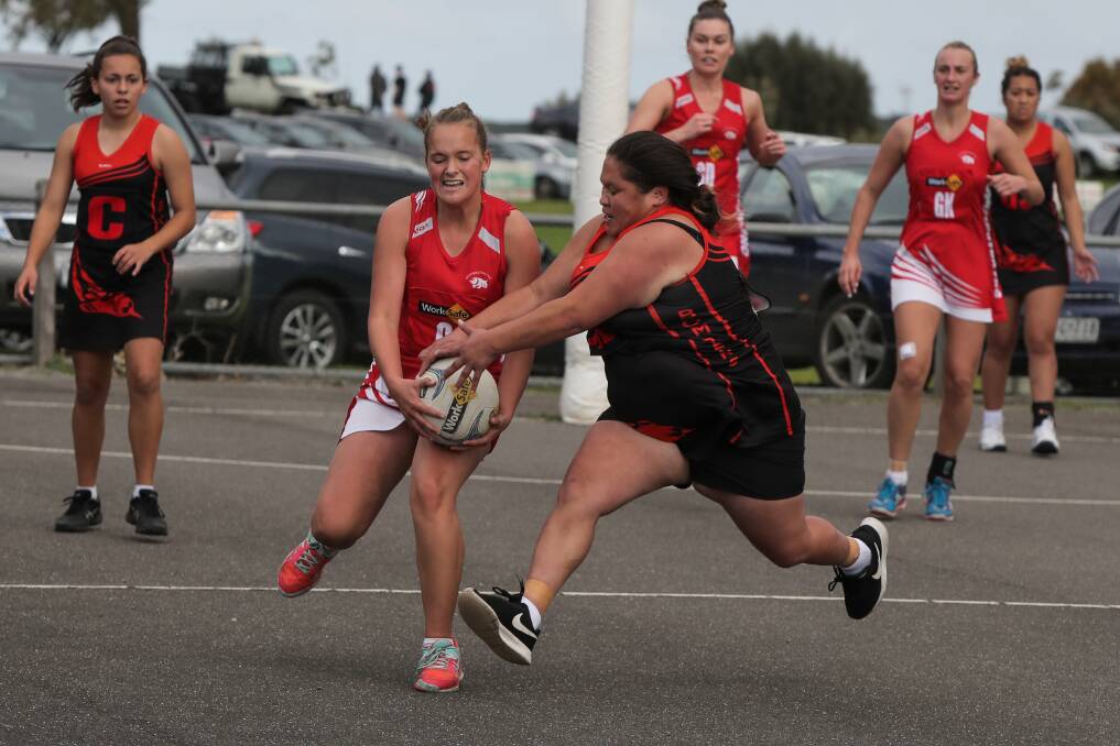 IT'S MINE: Dennington's Katelyn Grant collects the ball as East Warrnambool's Raiha Gillet comes in to try and prise it off her. Picture: Rob Gunstone