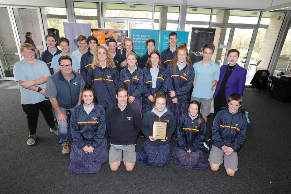 WINNING SKILLS: Schools Science Challenge winners Timboon P-12 with their trophy: "... it was fun challenging yourself to get the best result". Picture: Rob Gunstone