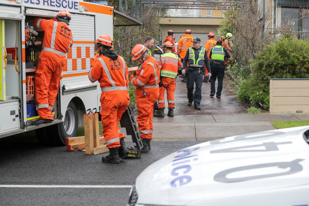 CAR TRAP: Emergency service workers at the scene of a car incident in Skiddaw Crescent in East Warrnambool on Wednesday. Picture: Rob Gunstone