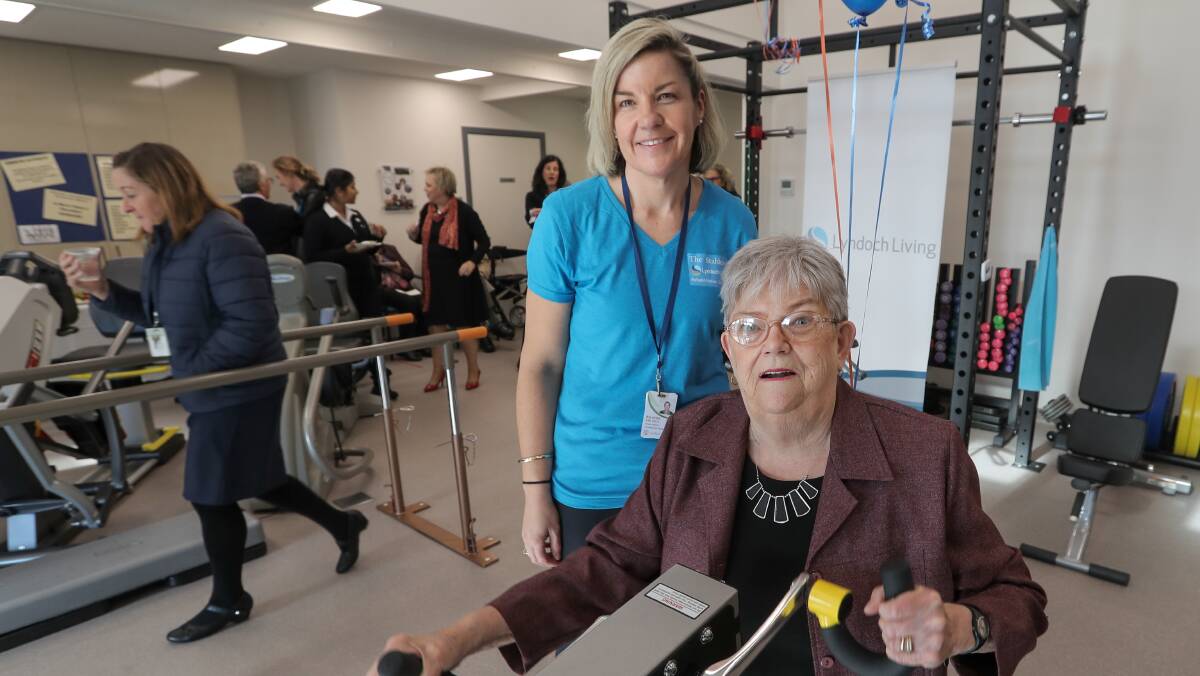 Keeping fit: Lyndoch Living resident Barb Peskett works out on an exercise machine as Belinda van Zelst from Lyndoch Living's rehabilitation services watches on.