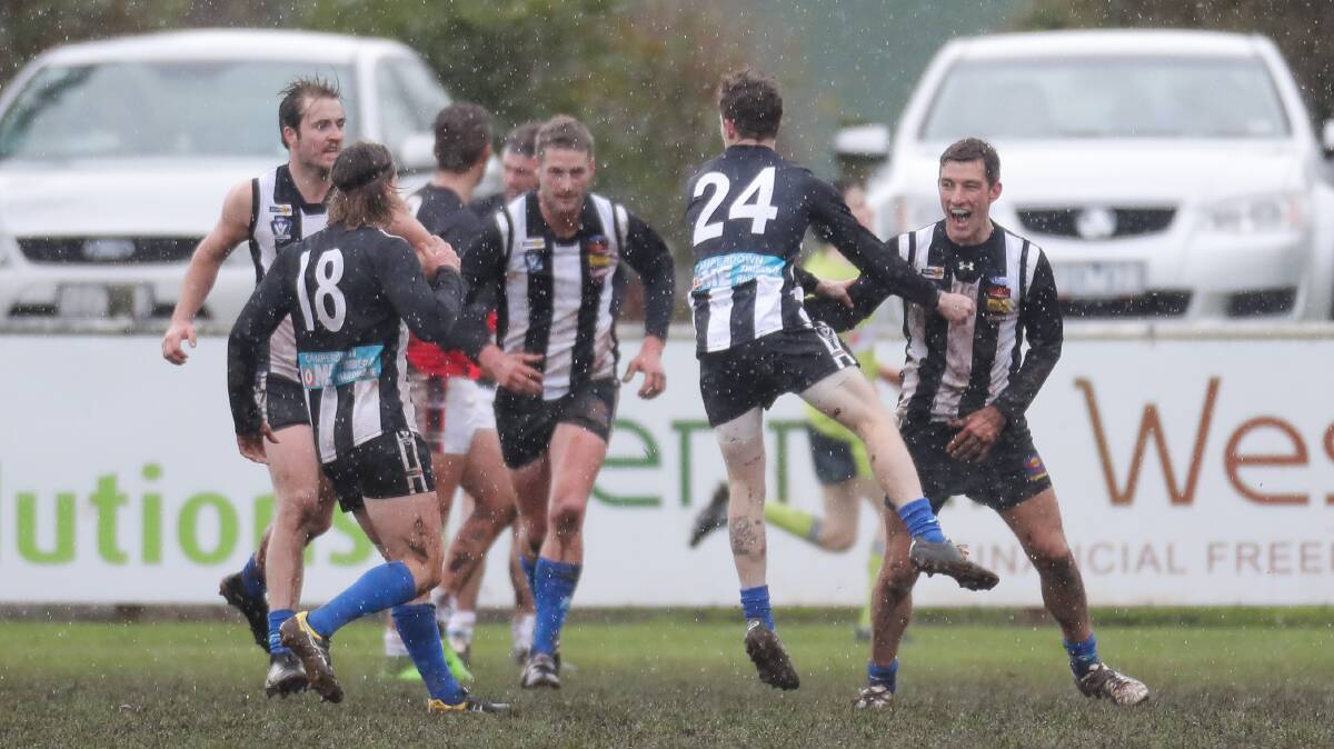 UP AND ABOUT: Camperdown players celebrate a goal during their victory over Cobden on Saturday. Picture: Morgan Hancock 