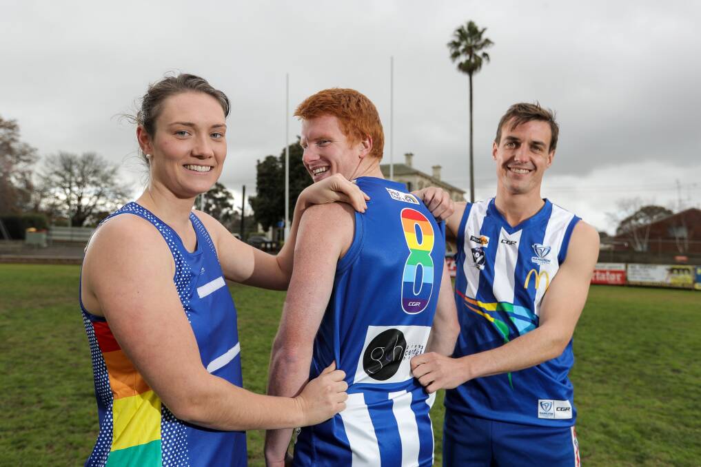 STANDING TOGETHER: Hamilton Kangaroos players Amanda Huf, Josh Pepper and Brady Hicks model the club's annual Pride Game uniforms. Picture: Rob Gunstone