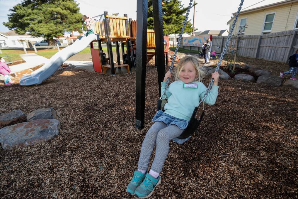 GREAT FUN: Kindergarten pupil Penny Taylor, 4, plays on the swing a the new playground in South Warrnambool. Picture: Morgan Hancock