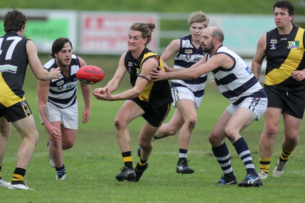 Merrivale's Sam Gleeson gets a handball out of traffic. He was best on ground in the Tigers' win. Picture: Rob Gunstone