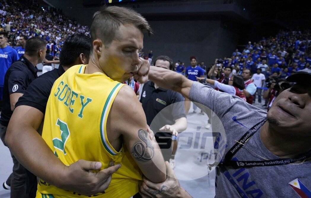 COP THAT: Australian basketballer Nathan Sobey is punched to the face during the Boomers' FIBA World Cup qualifier against the Philippines. 