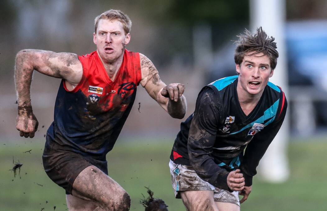 Timboon's Sam Newey and Kolora-Noorat's Luke Mcconnell run for the ball.  Picture: Christine Ansorge