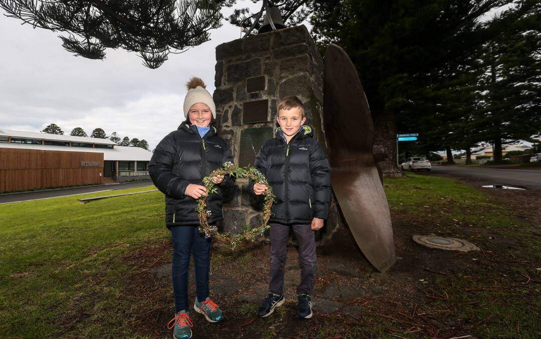 Paying tribute: Harriet Syme, 11, and Gus Syme, 8, lay a wreath to remember the 10 people who lost their lives when the SS Casino sank in 1932. Picture: Christine Ansorge