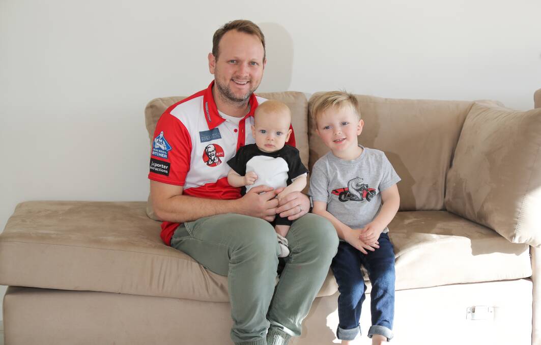 FAMILY TIME: South Warrnambool coach Mat Buck with his sons Hugo and Oscar at their Koroit home. Buck and wife Rachael are also foster carers. Picture: Morgan Hancock