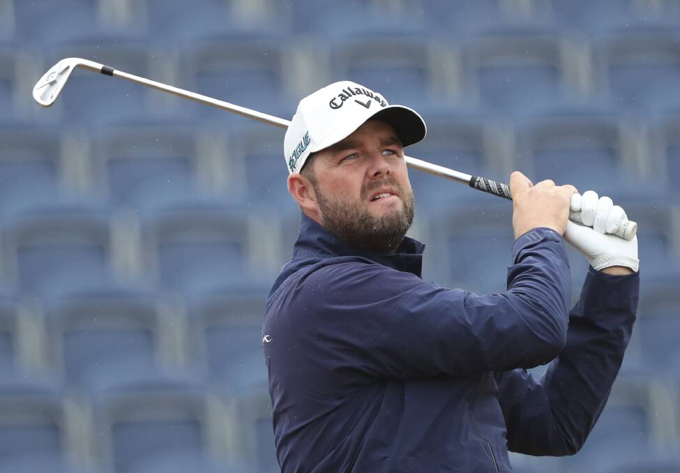 Concentration: Marc Leishman tees off on the 3rd hole during the second round of the British Open at Carnoustie. Picture: AP Photo