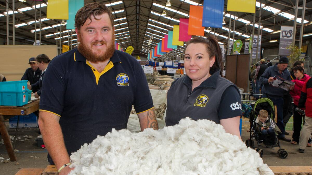 All among the wool: Shearer trainer Glen Stephens had a go at Sheepvention's wool handling competition as part of the friendly rivalry he has with his sister Tara Hadley, a champion wool handler. Picture: Everard Himmelreich