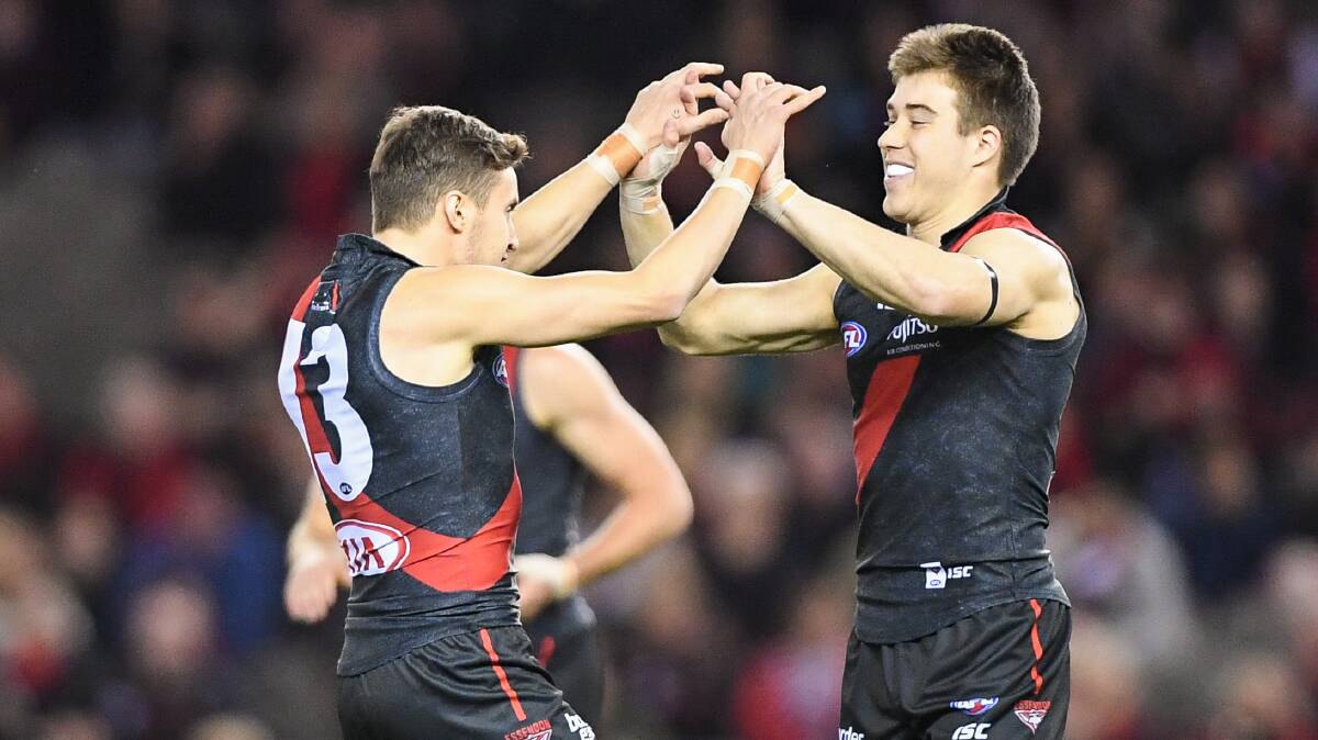 STEPPING DOWN: Orazio Fantasia, pictured here celebrating with Zach Merrett, was voted back into the leadership group but decided against rejoining it to focus on his own game. Picture: Morgan Hancock 