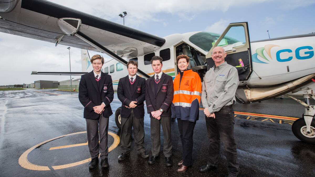 Checking it out: Emmanuel College students Alexander Turoczy, Jack O'Toole, and Nick Egan with Victoria's leading scientist Amanda Caples and Victorian Geological Survey director Paul McDonald. Picture: Christine Ansorge