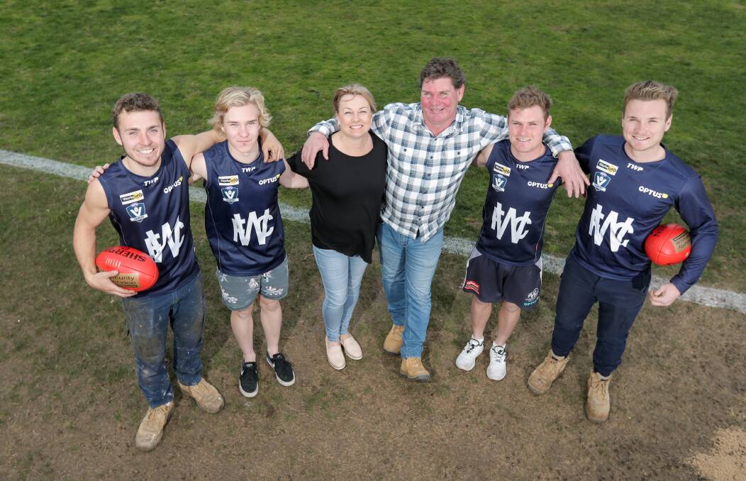 Family affair: Beau, Noah, Karen, Jeff, Jye and Jed Turland share a special moment at Reid Oval on Friday ahead of Saturday's clash. Picture: Morgan Hancock