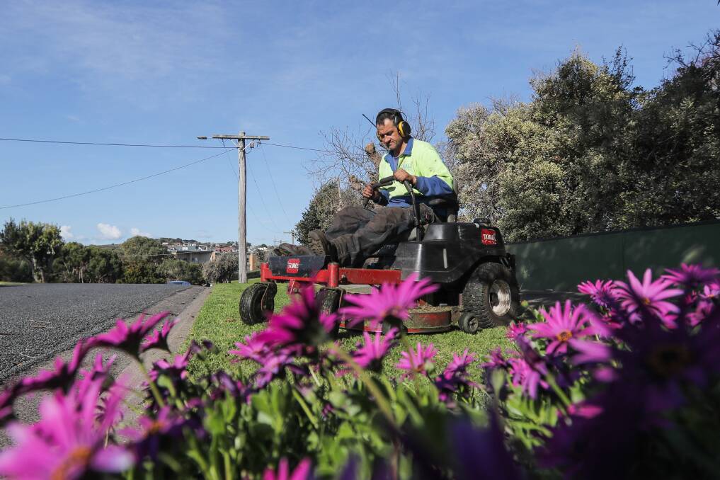 Busy: Warrnambool gardener James Dwyer is hard at work after consistent rain. Each Monday, he uses the weather forecast to plan his week and maximise the number of lawns he can mow while it's dry. Pictures: Morgan Hancock.