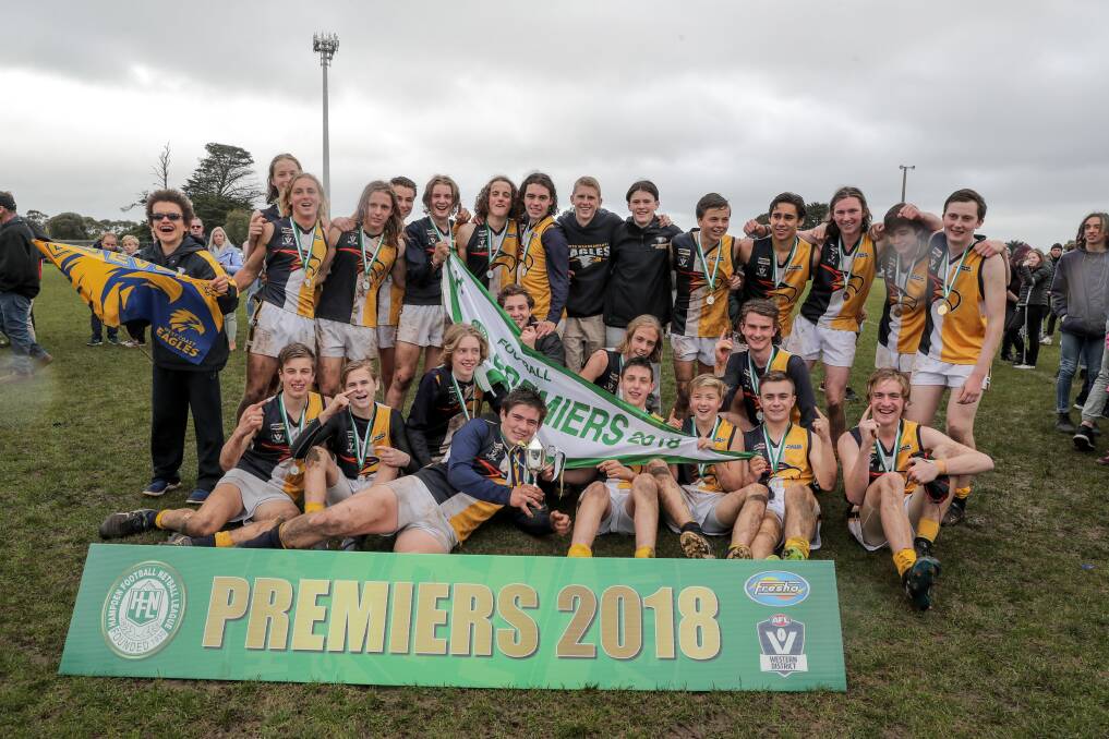 Underdogs: North Warrnambool players celebrate their victory in the under 16 grand final. Picture: Rob Gunstone