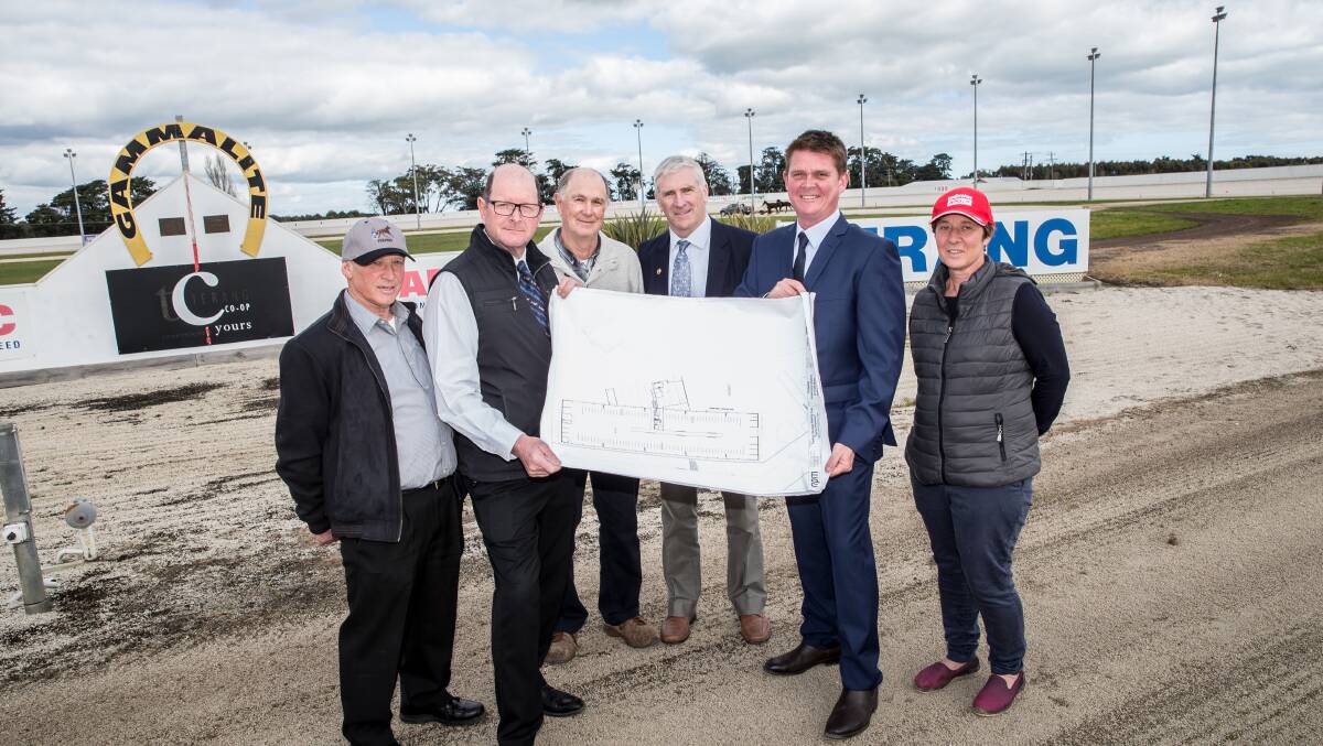 Taking shape: Terang Harness Racing Club member Peter Craven, president Evan Savage, members Allan Driscoll and Michael O'Keeffe, club manager Mark Roberts and member Marg Lee with the plans. Picture: Christine Ansorge