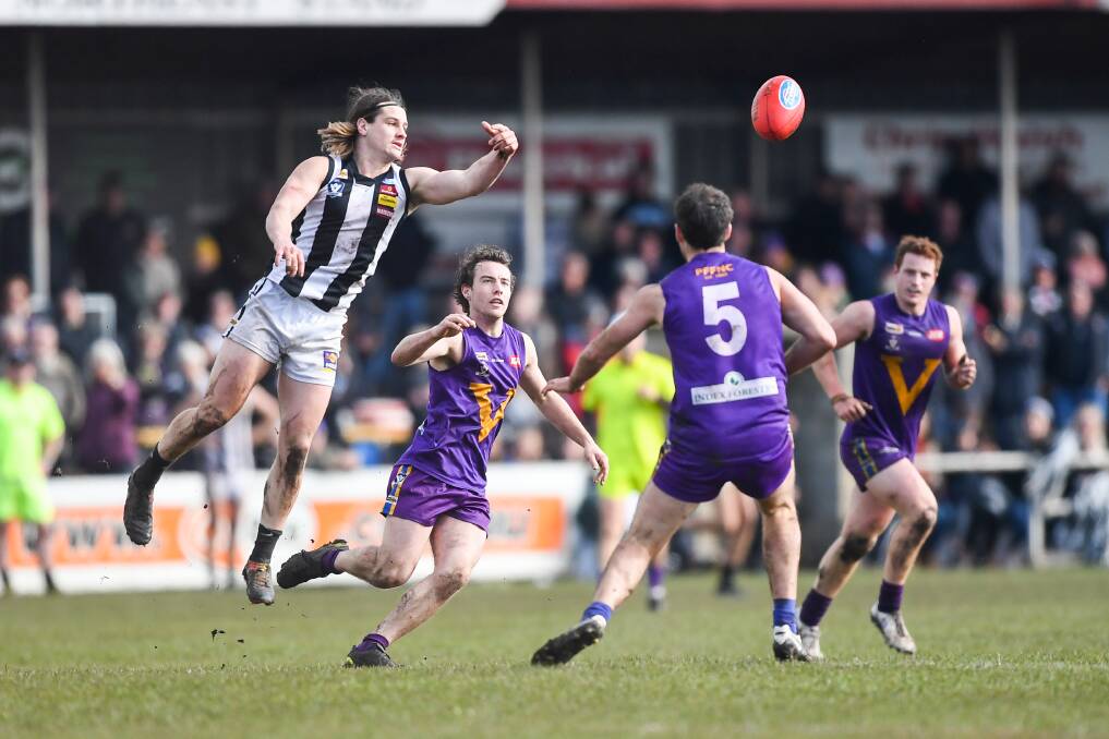 QUALIFYING FINAL: A big crowd watches Camperdown's Lachlan Bone oleaps for the ball against Port Fairy. Picture: Morgan Hancock