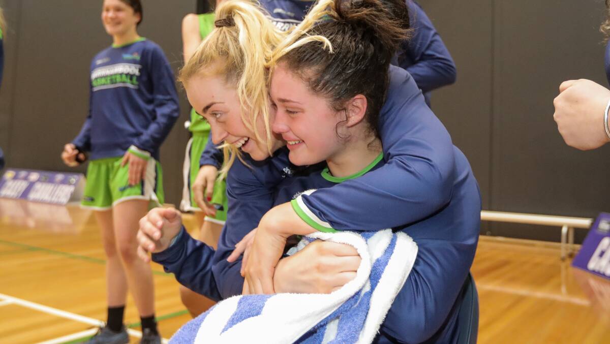 SWEET: Lily Killey of the Warrnambool Mermaids and Molly McKinnon of the Warrnambool Mermaids celebrate the win. Picture: Morgan Hancock 