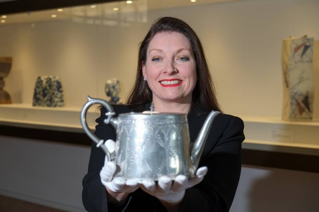Priceless: Hamilton Gallery director Sarah Schmidt admires a silver teapot donated to the gallery as part of a $1.25 million bequest from Western District woman Vera Lacey. Rob Gunstone