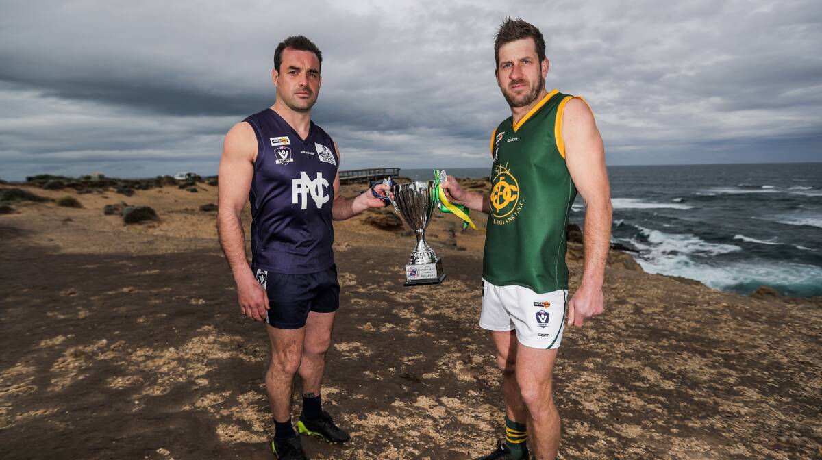 READY TO RUMBLE: Nirranda captain Peter McDowall and Old Collegians skipper Daryl Beechey show off what they are fighting for on Saturday. Picture: Morgan Hancock .
