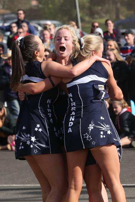 Winner: Nirranda coach Steph Townsend is mobbed by her team mates after an emotional win in Saturday's WDFNL A grade grand final against Dennington. Pictrure: Michael Chambers