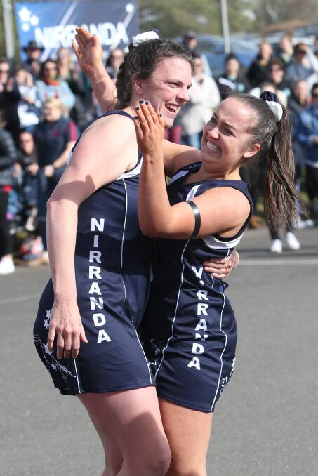 ELATED: Nirranda's Lisa Anders (left) and Georgia Haberfield celebrate the Blues' 2018 A grade premiership which ended an 18-year drought for the club.