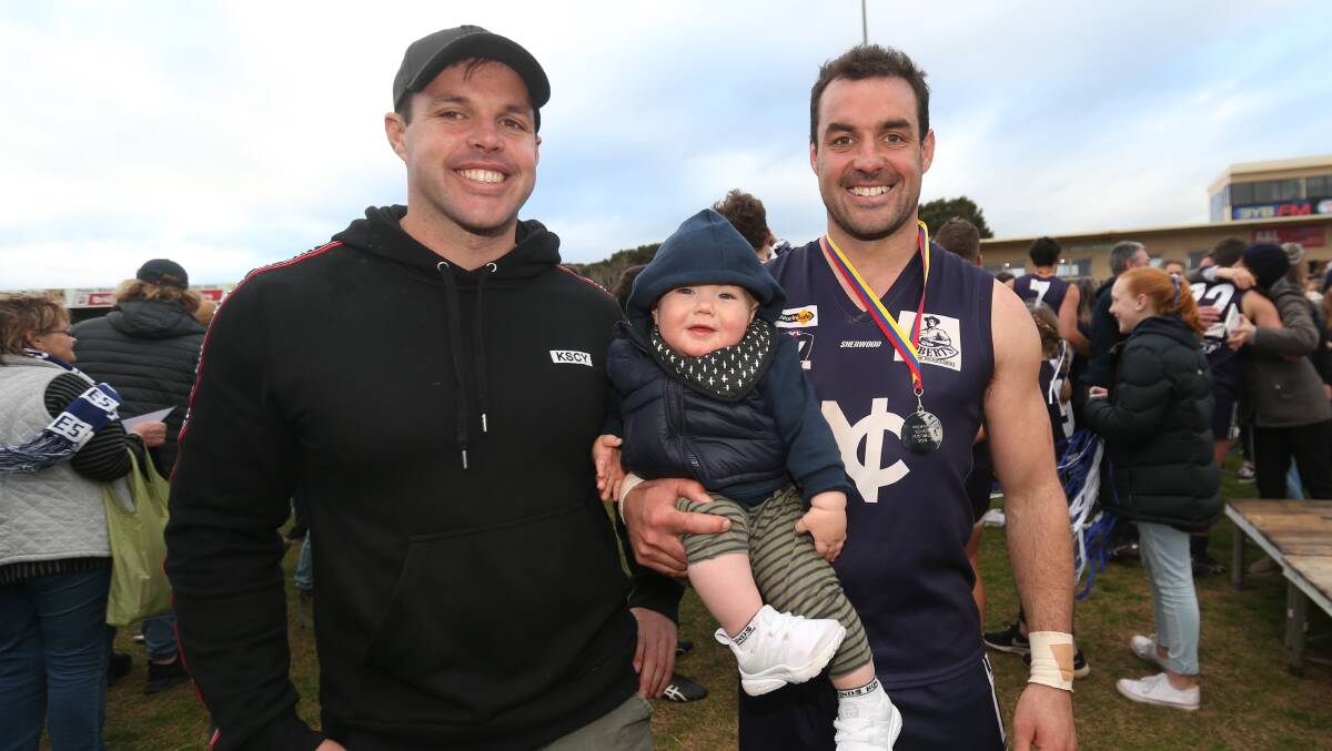 FAMILY: Brothers Mark and Peter Mcdowall with Mark's son William, 1, after the victory. Picture: Michael Chambers