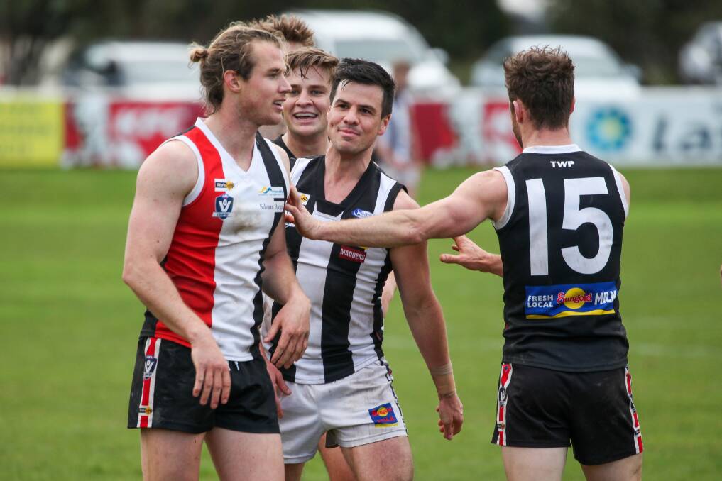 CHEEKY: Camperdown coach Phil Carse has a wry smile as Koroit's Will Couch is involved in a last-term scuffle. Picture: Justine McCullagh-Beasy