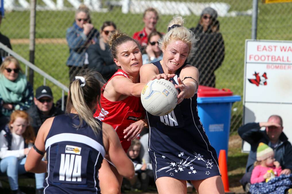 Classic battle: Dennington's Kristie Bolden and Nirranda's Steph Townsend compete for the ball in last year's decider. 