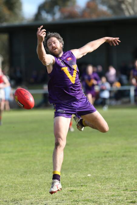 IN FLIGHT: Port Fairy's Jackson Hollmer shows ballet-like grace in the first semi-final against South Warrnambool. Picture: Michael Chambers