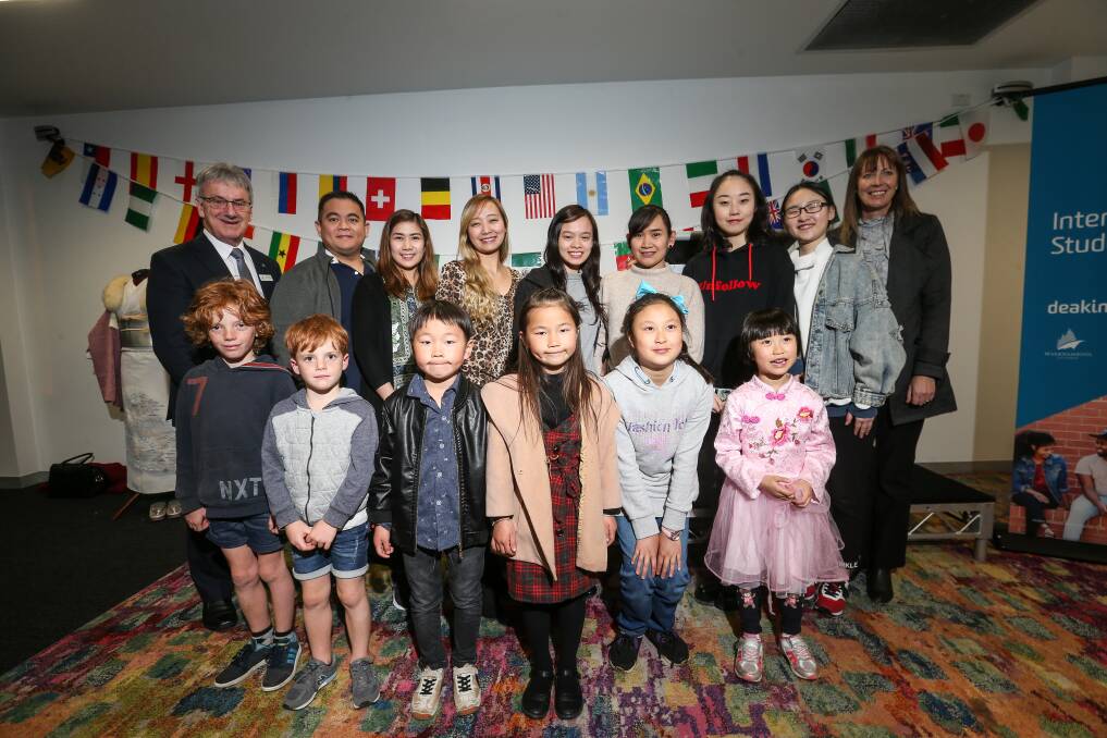 FUN: Warrnambool mayor Robert Anderson and international student advisor Zita Tattersall join  families at a dinner at Deakin University. Picture: Christine Ansorge