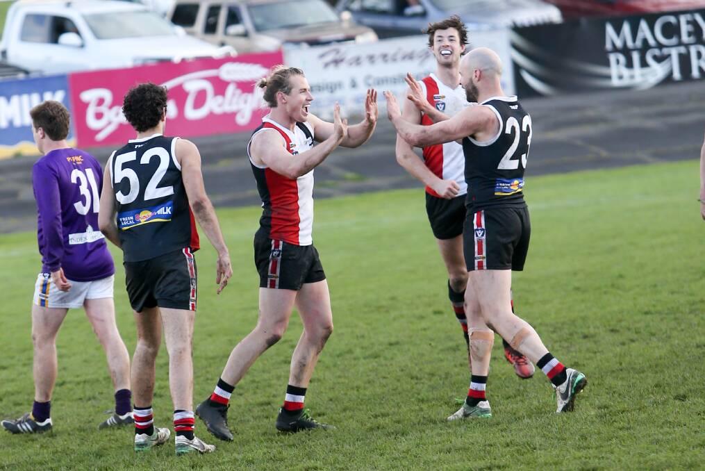 HAPPY: Will Couch and Damian O'Connor celebrating a goal in the preliminary final against Port Fairy last Saturday. The Saints face Camperdown in the grand final.  Picture: Michael Chambers