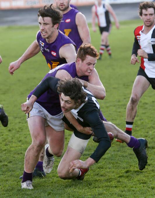 Hot footy: Koroit's Lachlan Rhook watches the ball slip away during the 2018 preliminary final between Koroit and Port Fairy.