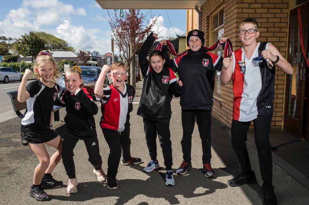 Cheers: St Patrick's Primary School Koroit student's Greta Bell, 11, Shelby O'Sullivan, 10, Jye Quirk, 10, Lucy McLaren, 9, Finn O'Sullivan, 12, and Mitchell Lloyd, 12, are confident of HFNL grand final wins. Picture: Christine Ansorge