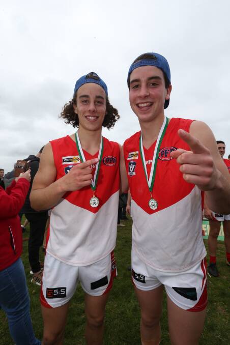 Brothers in arms: Marcus and Liam Herbert celebrate South Warrnambool's under 18.5 Hampden league flag in 2018. 