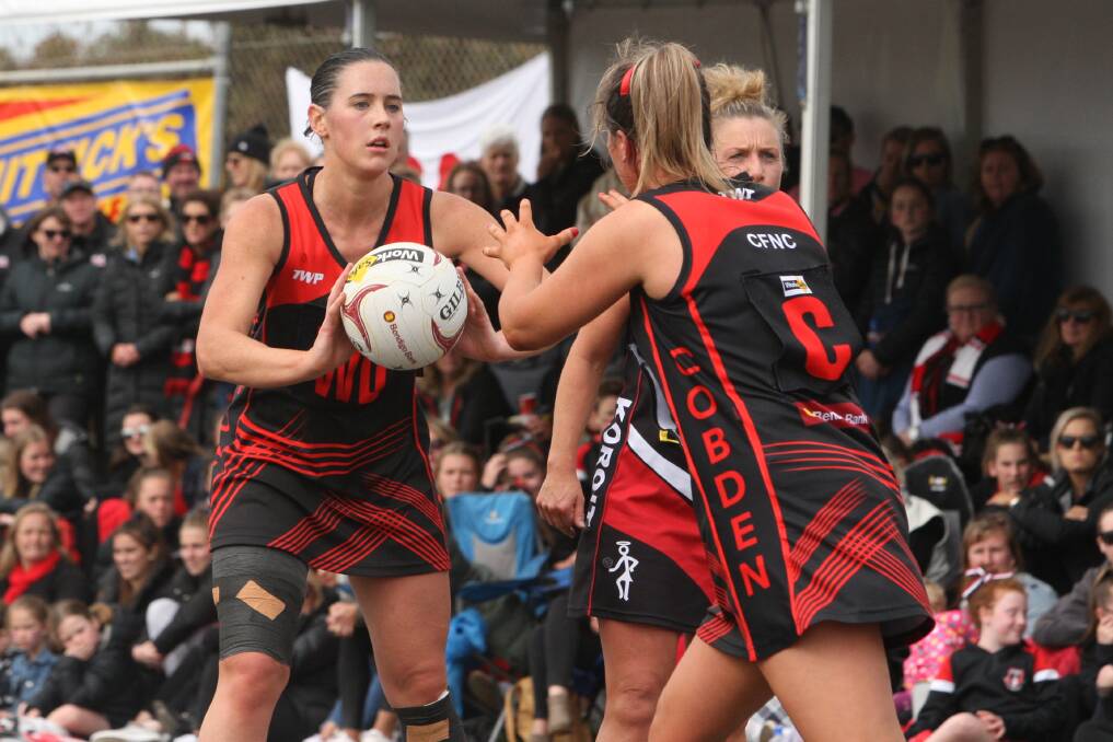 Put it in your diary: Cobden's Sophie Barr passes through to Alicia Blain in the 2018 grand final loss to Koroit. The Bombers will have to wait until round seven for the grand final rematch. 