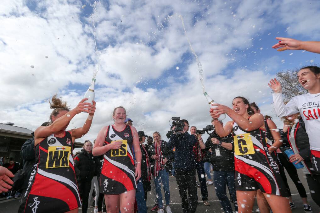 MOMENT TO REMEMBER: Koroit players enjoy their back-to-back Hampden netball flags. Picture: Michael Chambers