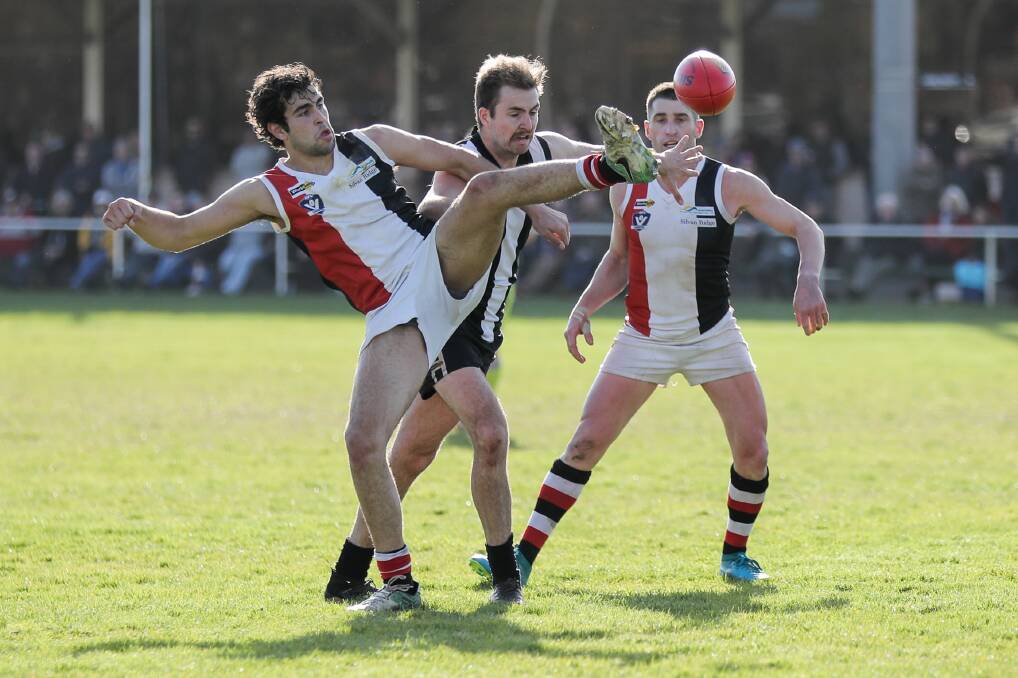 FLY KICK: Koroit's Josh Chatfield tries to get boot to ball in the Hampden league grand final against Camperdown. Picture: Morgan Hancock