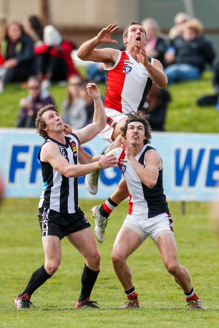 FLYING: Koroit's Todd McLean leaps for a mark in the grand final against Koroit. Picture: Morgan Hancock