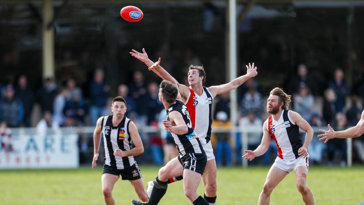 Koroit's Jeremy Hausler gets the tap over Camperdown's Will Rowbottom. Picture: Morgan Hancock