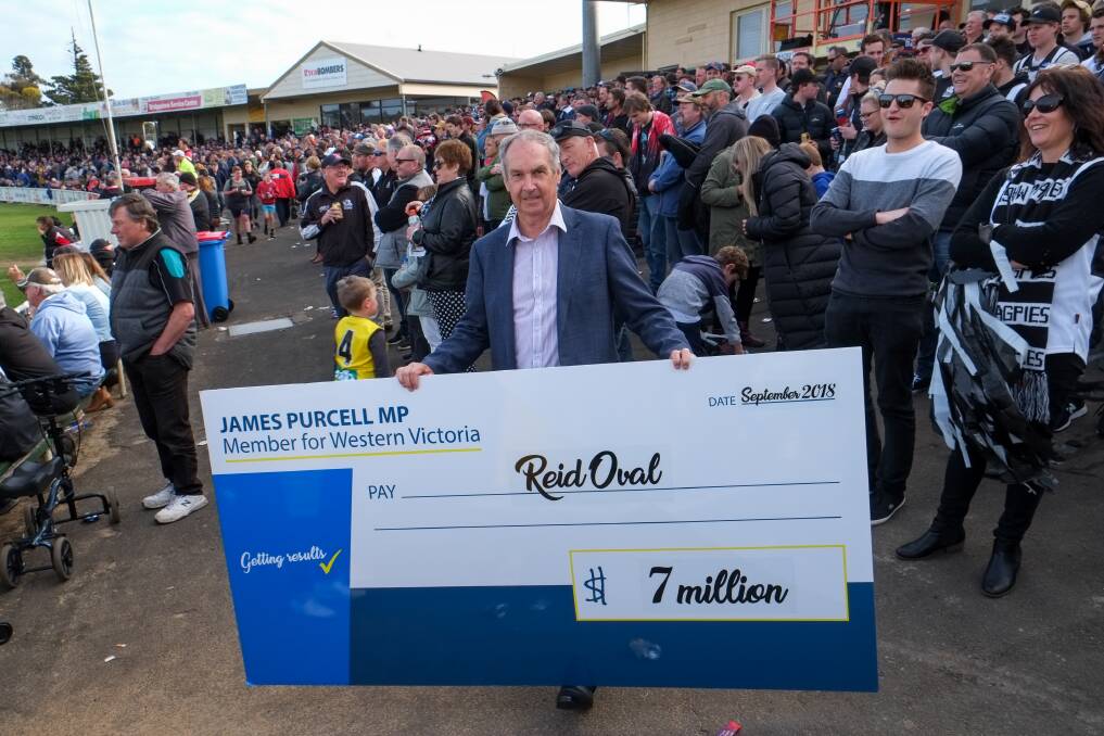 GET THE WORKS DONE: Member for Western Victoria James Purcell with his giant cheque to fund the Reid Oval upgrades. Picture: Rob Gunstone